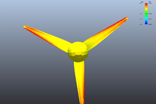 wind turbine facing the wind: blades in yellow and red overpressure